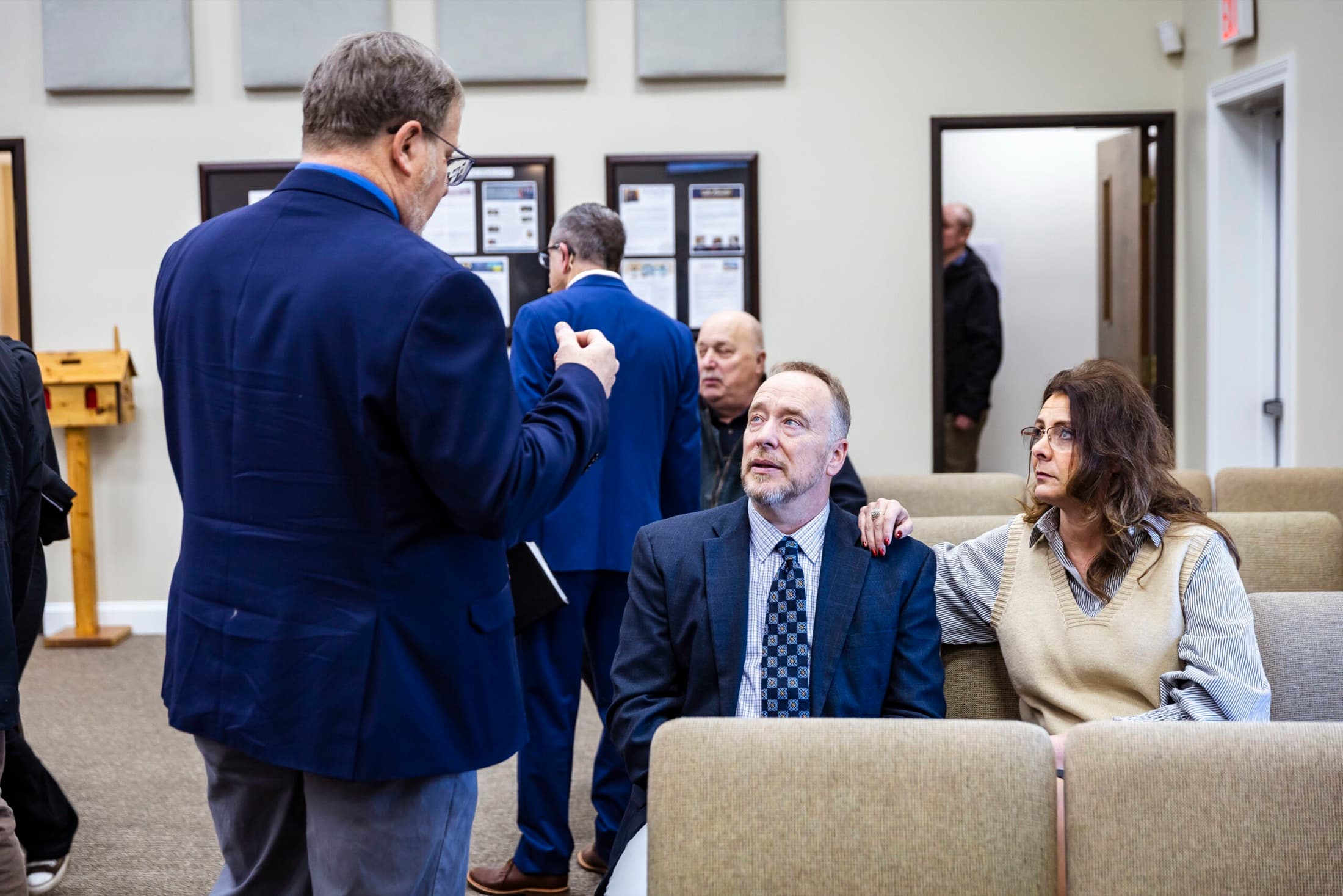 Friends greeting each other before service